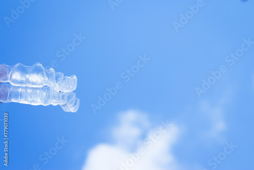 Invisible teeth aligner on light background