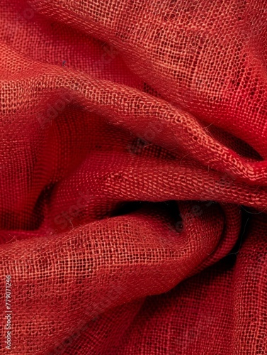 Elegant drapery of rich red burlap fabric, showcasing folds and texture, suitable for background or design purposes. Burlap fabric texture - background