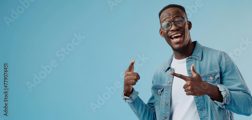 Cheerful african woman wearing glasses jean jacket having white snow smile pointing fingers aside at copy space created with Generative AI technology photo