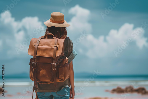 Beautiful young woman traveler or backpacker wears travel bag and hat for summer time vacation #779077476