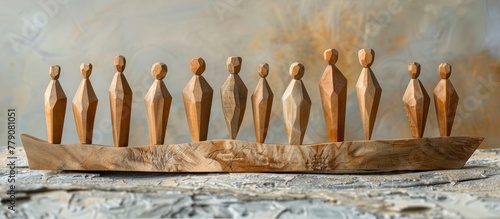 A group of wooden figures sit calmly on top of a wooden boat, creating a serene scene.