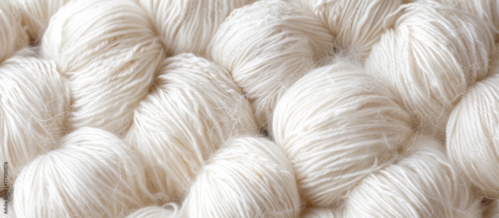 A close-up view of a fluffy and pristine white skein of yarn.
