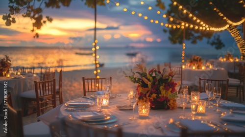Fototapeta Naklejka Na Ścianę i Meble -  Decorated table at the beach resort in sunset time near the sea and sand for wedding and party events celebrations