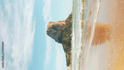 Calpe, Spain. Rock Penon de Ifach .Mediterranean Sea beach. Vertical video photo