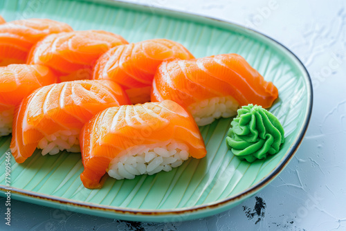 Salmon sushi set on a green plate
