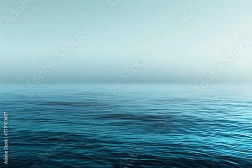 The image is of a calm, blue ocean with no visible waves © mila103