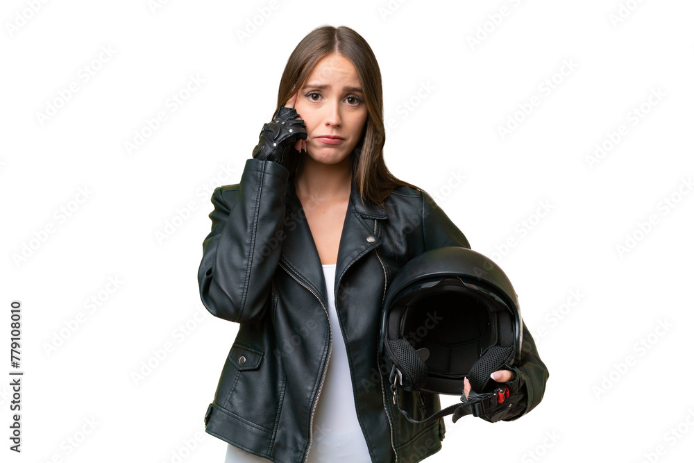 Young pretty caucasian woman with a motorcycle helmet over isolated background thinking an idea Young pretty caucasian woman with a motorcycle helmet over isolated background thinking an idea