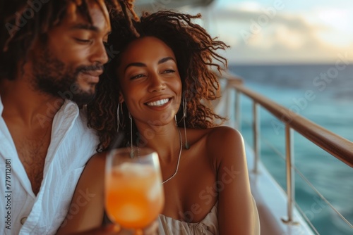 African-American couple embracing while enjoying a cocktail on a summer cruise ship