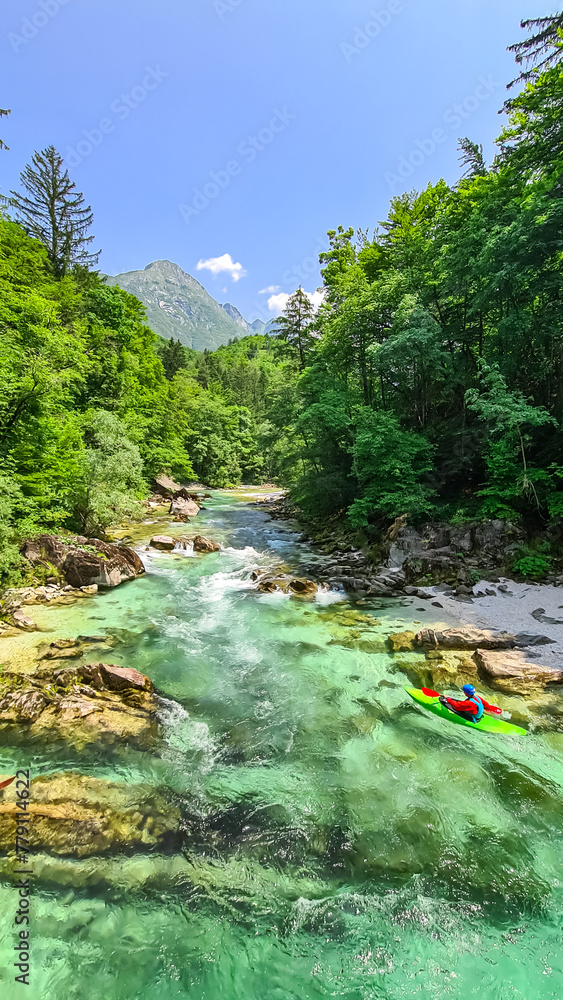 Scenic view of mount Svinjak and Soca river in Bovec, Triglav National Park, Slovenia. Magnificent Soca Valley in stunning Julian Alps. Wanderlust in untamed Slovenian Alps. Hike in alpine wilderness