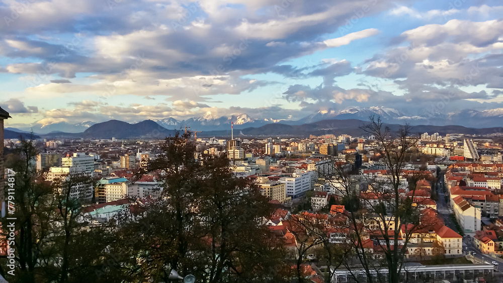 Breathtaking aerial view of Ljubljana, Slovenia, Europe. Looking from renowned Ljubljana Castle, an architectural masterpiece. Snow capped mountain peaks of Karawanks and Julian Alps in background