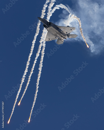 Bottom view of a F-22 Raptor deploying flares