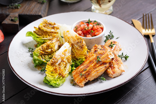 Keto lunch or dinner. Grilled chicken fillet with mini romen and tomatoes salsa.