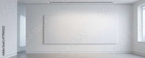 Minimalist white wall in a modern office interior with a single large white canvas