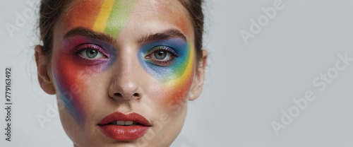 Close-up of a colorful rainbow woman head isolated on panoramic white background with copy-space, colors vision, web banner and gay LGBTQ pride concept 