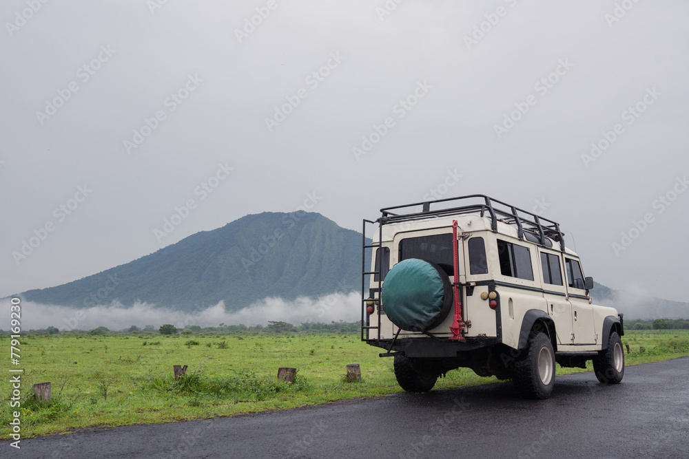 A safari car drives through Baluran National Park, Indonesia