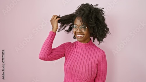 Confident african american woman exuding natural charm, laughing away, standing side-profile with a radiant smile and glasses photo