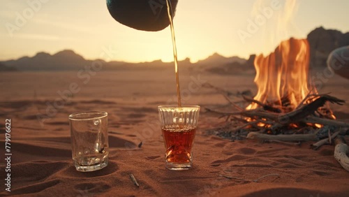 Tea poured in a glass at the Camp Fire in Jordan Wadi Rum desert