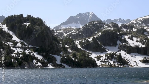 Pico de alta montaña y lago alimentado con agua en primavera. Lago Major de Colomers. Pirineos, Vall d'Aran, Cataluña, España. photo
