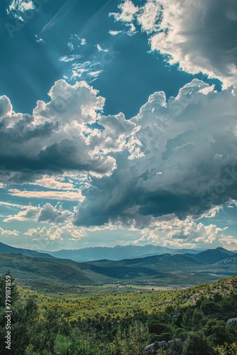 A scenic view of a mountain range with dramatic clouds in the sky. Perfect for travel and nature concepts