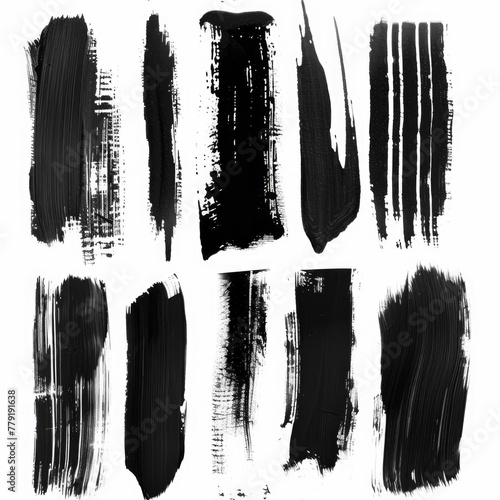 A collection of black paint strokes on a white background. Suitable for artistic projects photo