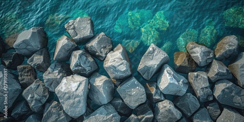 Group of rocks sitting on top of a body of water. Suitable for nature and landscape themes