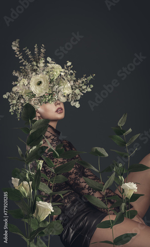 A sensual woman with floral headdress poses amidst lush leaves and blooms in an artistic botanical portrait.