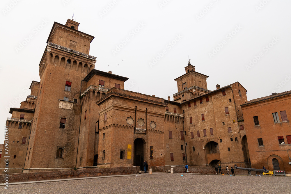 City of Ferrara, historic center, fortifications and castle surrounded by a moat. Squares and buildings in medieval style. Beautiful, unique Italian cities. World cultural heritage. Precious details.