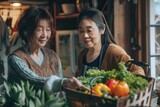 two Asian ladies doing food shopping, buying vegetables
