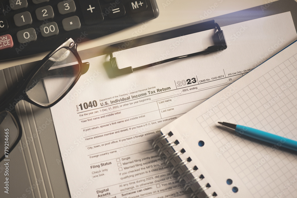 Tax income concept US tax form on table Tax income concept US tax form on table