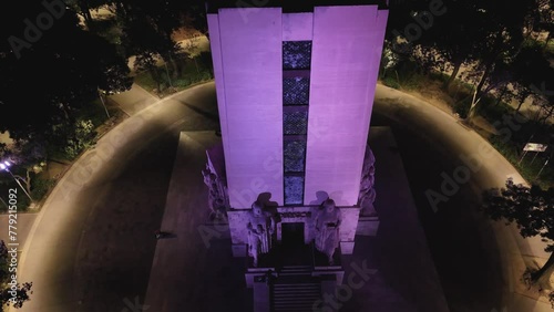 Alvaro Obregon Monument illuminated in purple at night in CDMX photo