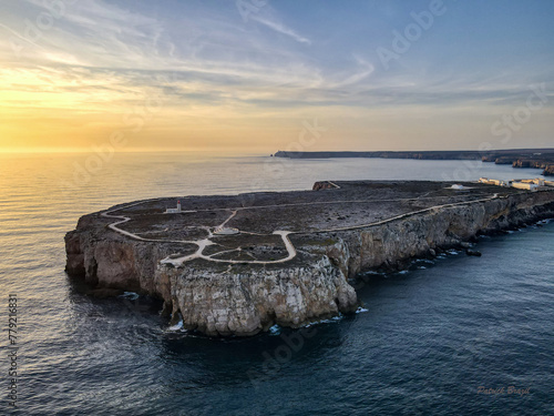 Cape Sagres, Portugal, at sunset with Sao Vincent in the background