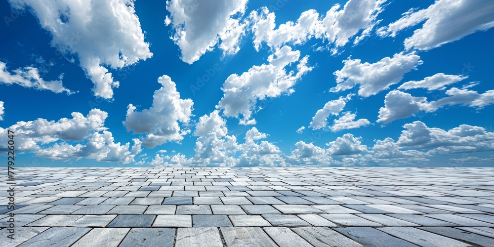 paving slabs and blue sky with clouds.  background with perspective.  place for creative text, advertising - obrazy, fototapety, plakaty 