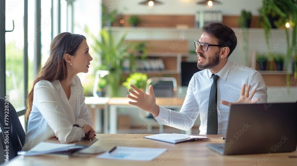 Business Man and Woman Talking at Table Business Man and Woman Talking at Table