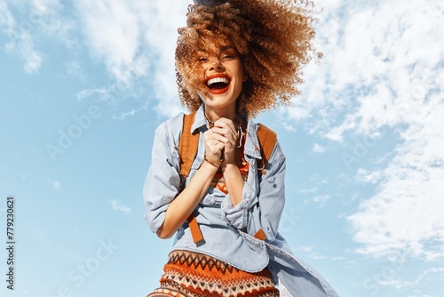 Laid-back Beach Babe: A Smiling Woman with a Backpack, Embracing the Hippie Lifestyle, Enjoying the Freedom of Nature's Portrait