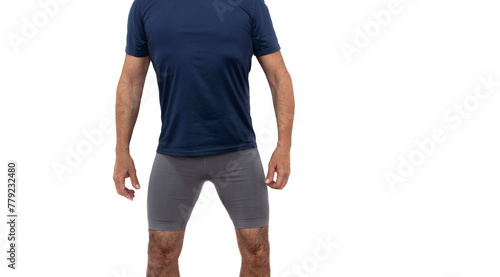 Mature man in sportswear, blue t-shirt and gray shorts, hairy legs, standing and looking forward. Isolated in a white background. Concept of well-being in old age.