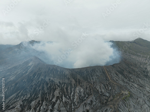 Aerial view of Mount Bromo crater filled with volcanic smoke © WarnaDunia