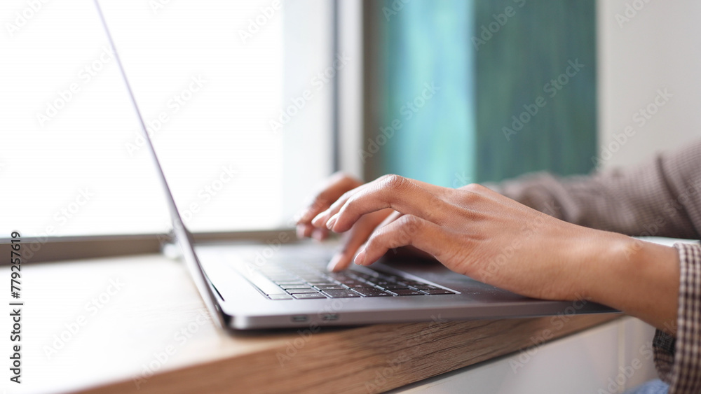 Close-up shot of a woman working on a laptop Close-up shot of a woman working on a laptop