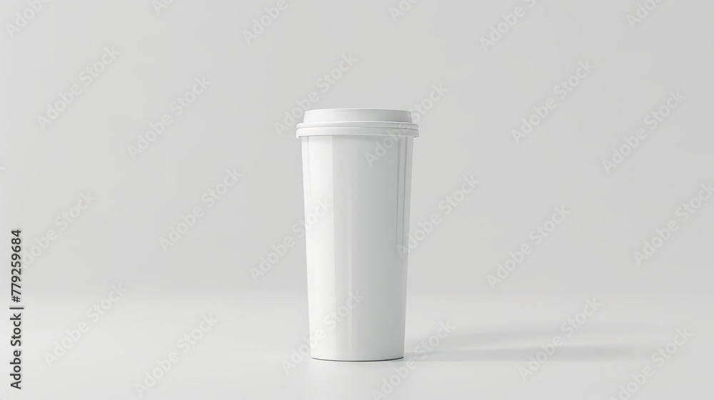 A long white plastic cup on a gray room background. Large size plastic cup. A long white plastic cup on a gray room background. Large size plastic cup.