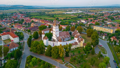 Sunset view of the Fortified Evangelical Church in Harman, Romania photo