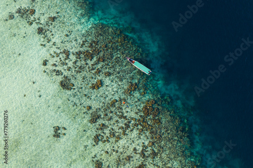 Aerial view of snorkeling activities among a coral reef