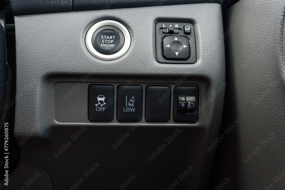 A car's dashboard with a start button A car's dashboard with a start button