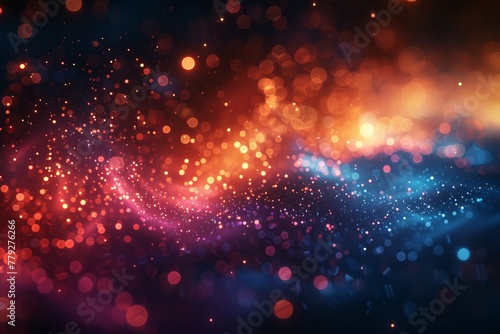 A spectacular visual of colorful particles cascading in a flow that creates a vibrant spectrum of red, blue, and purple tones, resembling a nebula