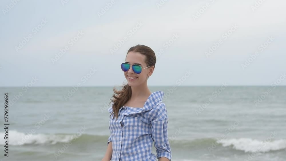 Cheerful asian woman barefoot walking on tropical summer beach. Woman walking along wave of sea water and sand on the beach. Enjoyment barefoot walk outdoor with freedom. Relaxation Travel Concept. Cheerful asian woman barefoot walking on tropical summer beach. Woman walking along wave of sea water and sand on the beach. Enjoyment barefoot walk outdoor with freedom. Relaxation Travel Concept.