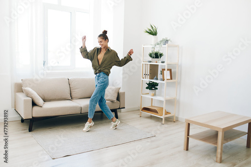 Playful Joy: A Happy Woman Jumping and Dancing in her Home Interior