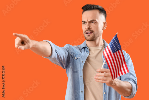 Young man with USA flag poi...
