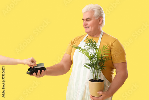 Mature gardener receiving p...