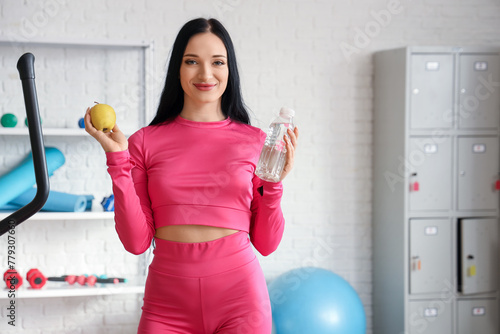 Smiling woman in pink activ...