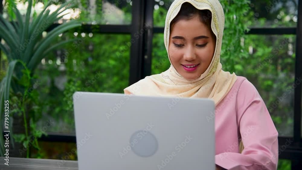 Muslim woman wear hijab work from home office typing laptop keyboard on ...