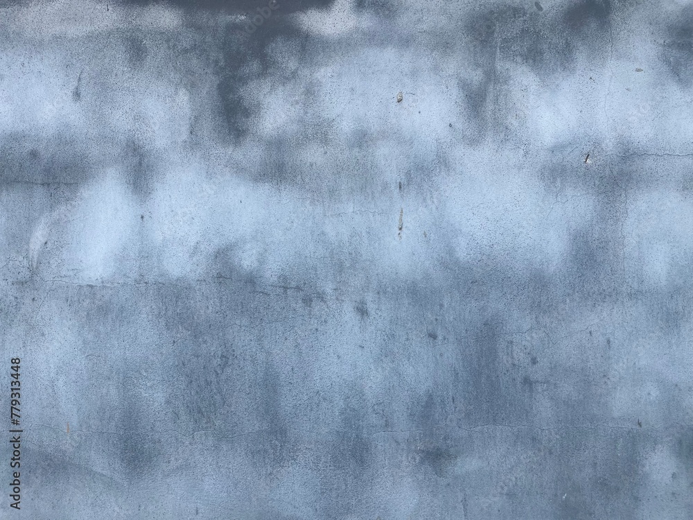 A grid formed from brickwork traces on a concrete wall.