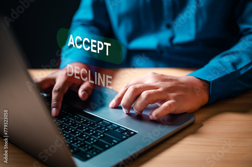 accept, strategy, approve, typing, value, information, diagnosis, development, security, analysis. A man is typing on a laptop with the words accept and decline displayed on the screen.